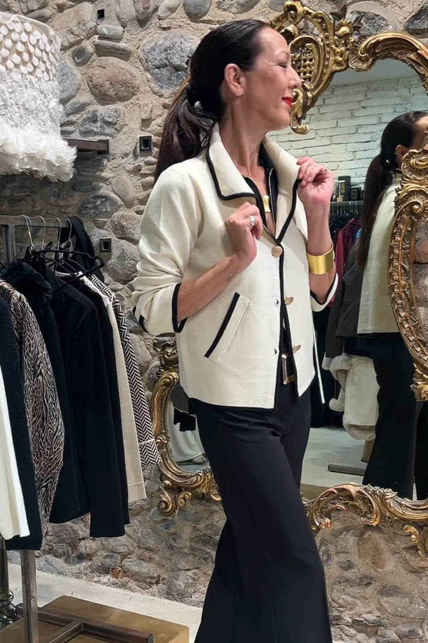 Beige jacket with black trim